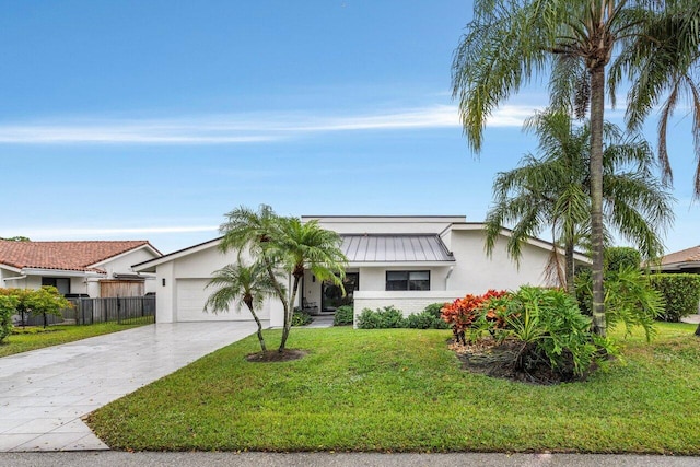 ranch-style house featuring a garage and a front yard