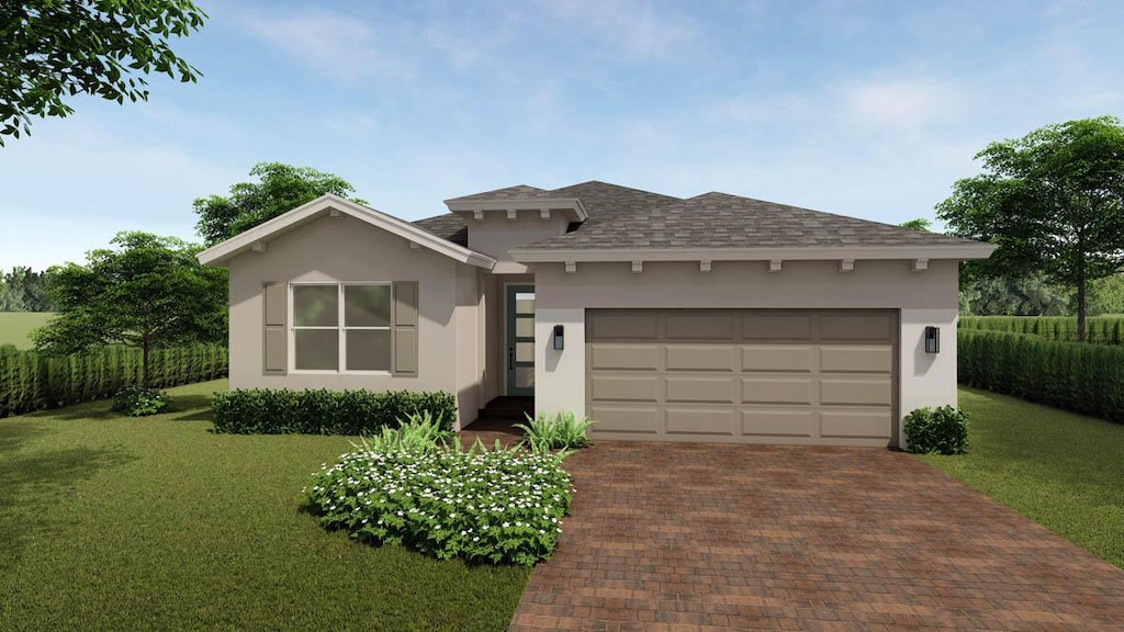 view of front of home with a garage and a front yard