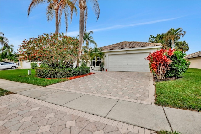 view of front of property featuring a garage and a front lawn