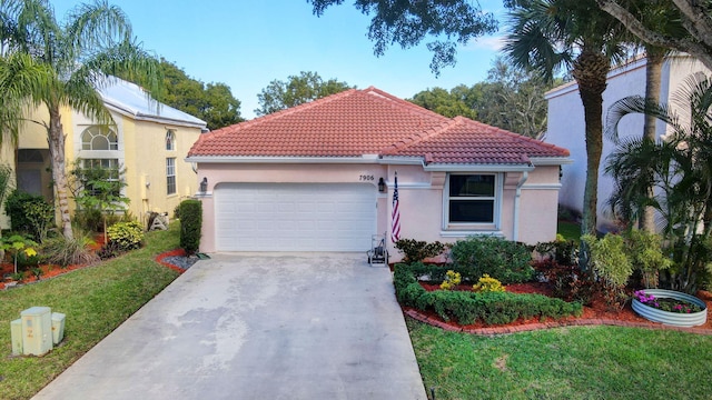 mediterranean / spanish-style home featuring a garage and a front lawn