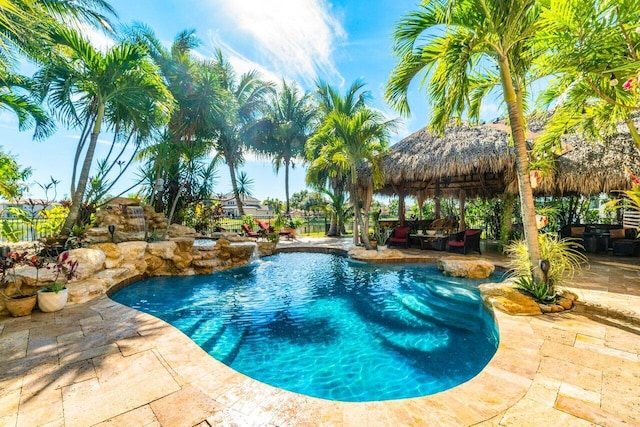 view of swimming pool featuring a gazebo and a patio area