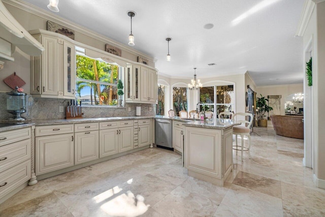 kitchen featuring an inviting chandelier, decorative light fixtures, dishwasher, and cream cabinets