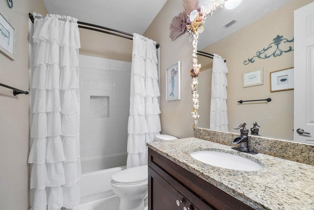 full bathroom with shower / bath combination with curtain, vanity, and toilet