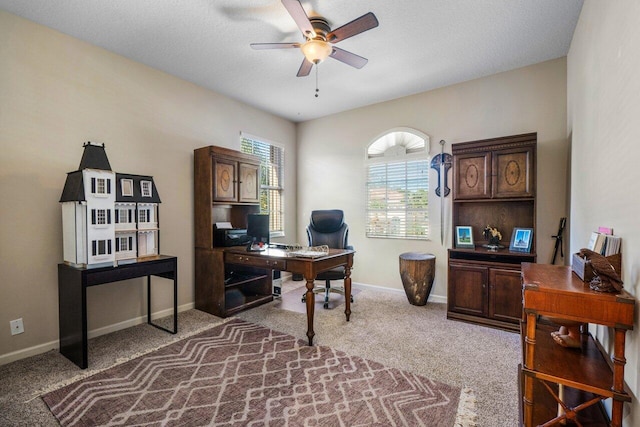 home office with carpet floors and ceiling fan