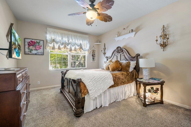 bedroom with ceiling fan and carpet flooring