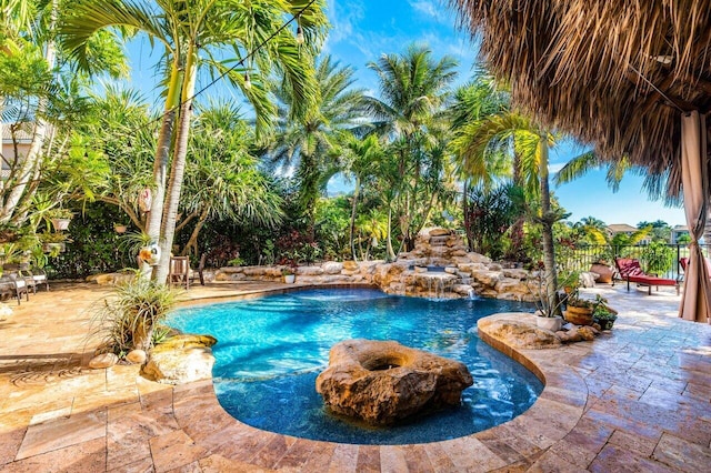 view of pool featuring a patio and pool water feature