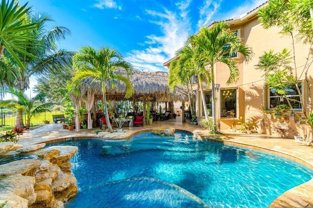 view of swimming pool featuring a patio area