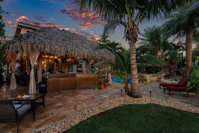 view of patio terrace at dusk