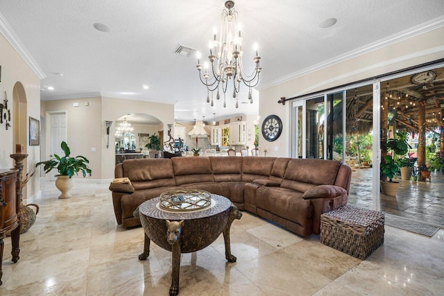 living room with ornamental molding, a textured ceiling, and an inviting chandelier