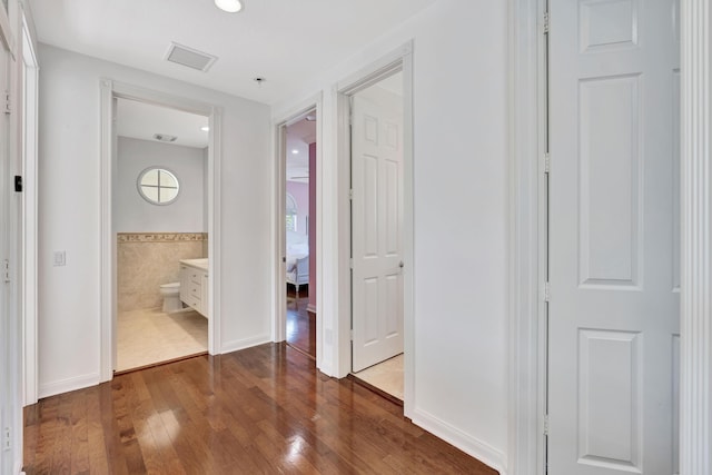 hallway with wood-type flooring