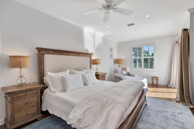 bedroom featuring crown molding, ceiling fan, and hardwood / wood-style floors