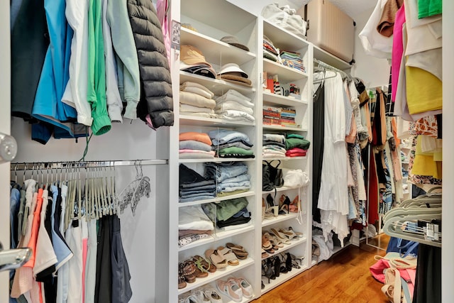 walk in closet featuring hardwood / wood-style floors