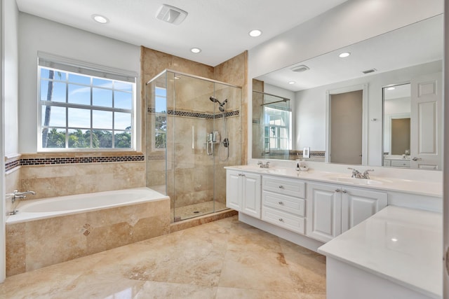 bathroom featuring vanity and separate shower and tub