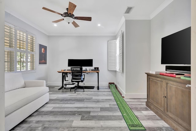 home office featuring crown molding, ceiling fan, and light wood-type flooring