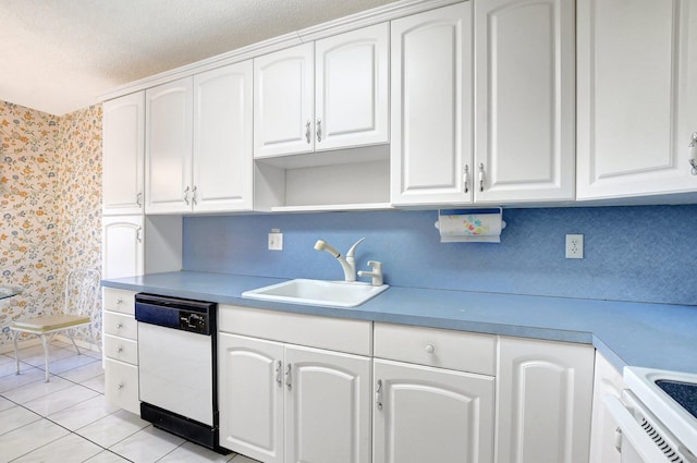 kitchen featuring white cabinetry, sink, white appliances, and light tile patterned flooring