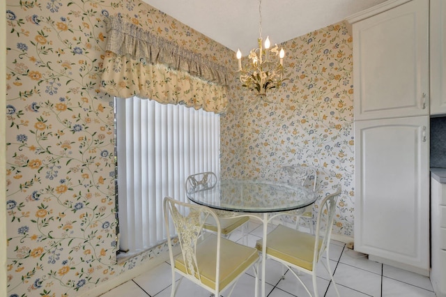 dining area featuring light tile patterned floors and a chandelier