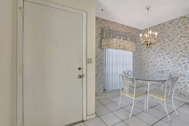 unfurnished dining area featuring an inviting chandelier and light tile patterned flooring