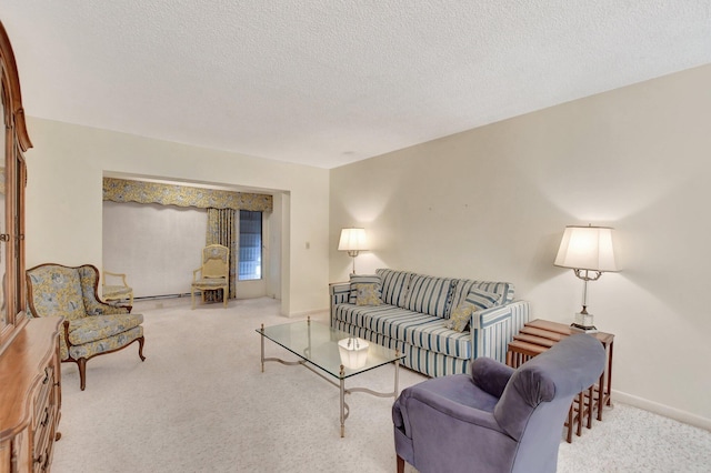 living room with light carpet and a textured ceiling