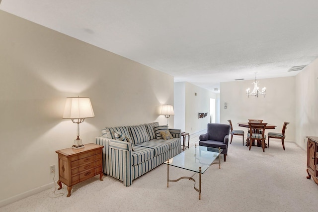 carpeted living room featuring a notable chandelier