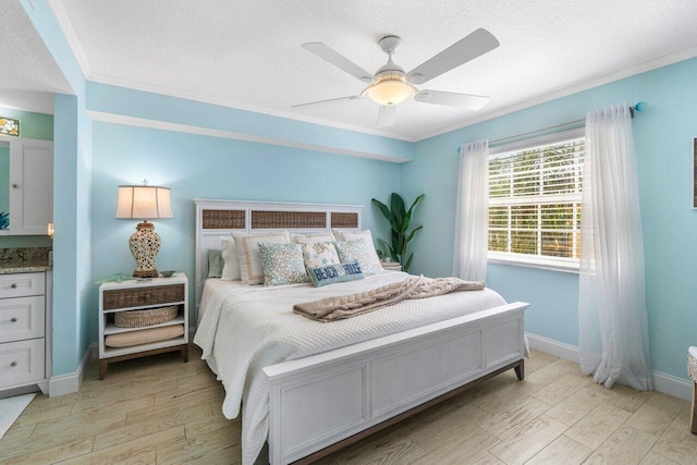 bedroom with crown molding, light hardwood / wood-style floors, a textured ceiling, and ceiling fan