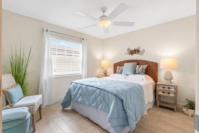 bedroom with light wood-type flooring and ceiling fan