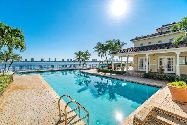 view of pool with a patio area and french doors