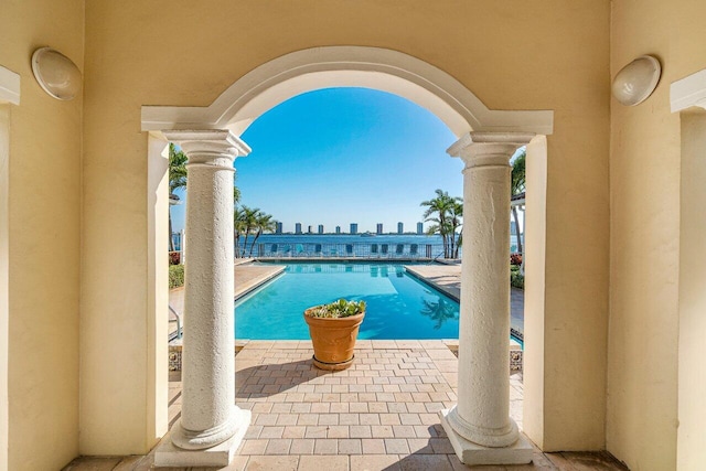 view of swimming pool featuring a patio area