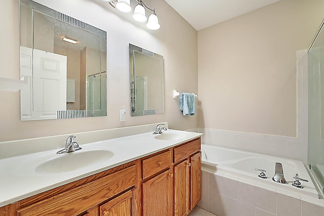 bathroom with vanity and separate shower and tub