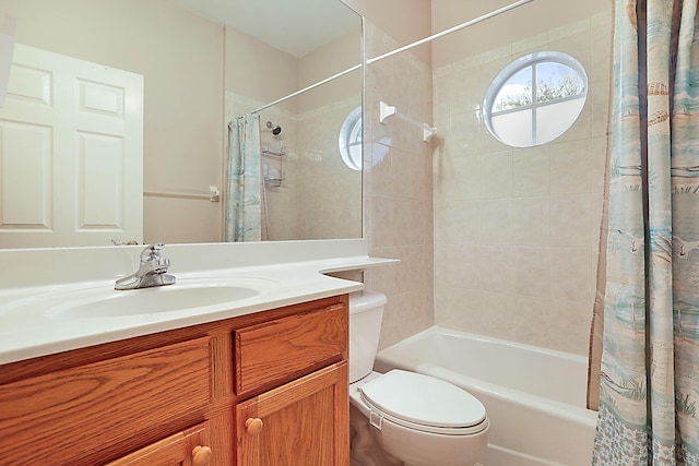 full bathroom with vanity, toilet, and shower / bath combo with shower curtain