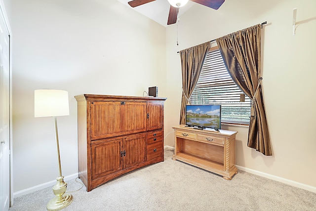 bedroom with light colored carpet and ceiling fan