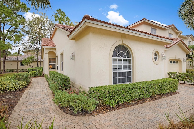 view of home's exterior with a garage