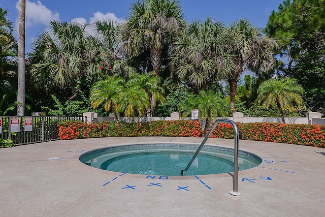 view of swimming pool featuring a community hot tub