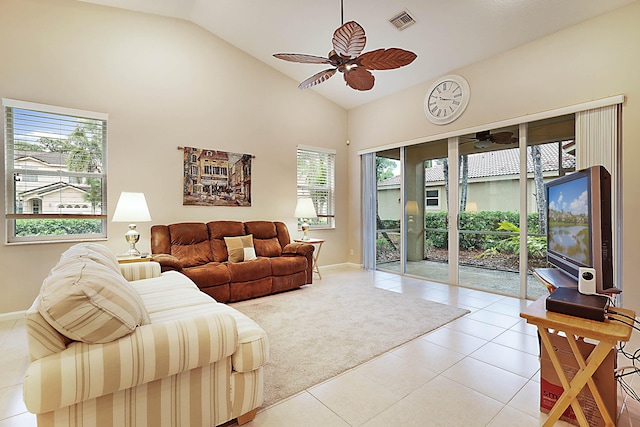 tiled living room with vaulted ceiling and ceiling fan