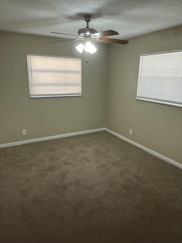 spare room with baseboards, a textured ceiling, ceiling fan, and carpet flooring