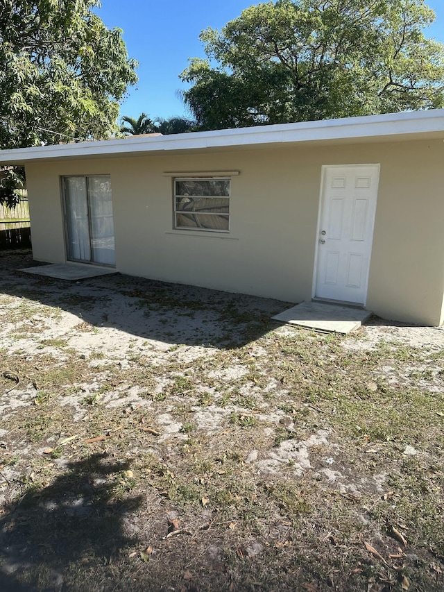 back of property with stucco siding