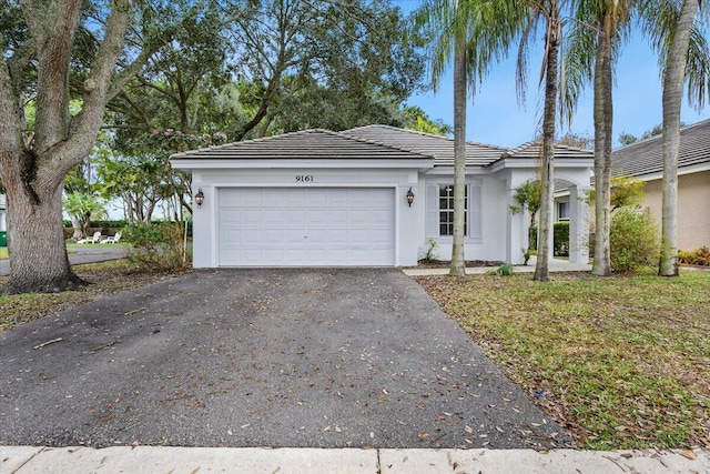 ranch-style home with a garage