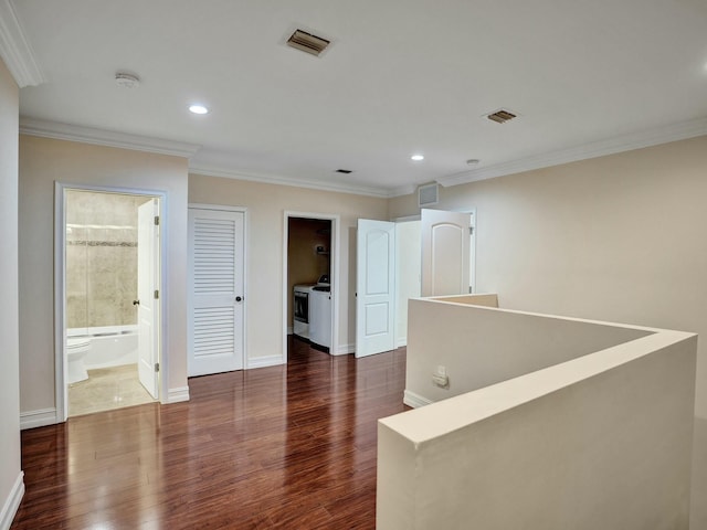 corridor with ornamental molding and dark hardwood / wood-style floors