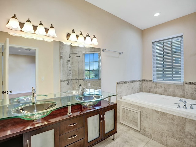 bathroom featuring tile patterned floors, vanity, and plus walk in shower