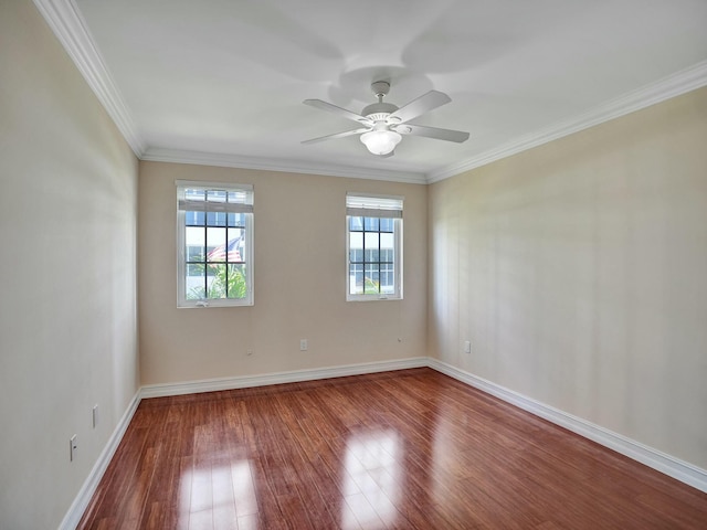 spare room featuring wood-type flooring, ceiling fan, and crown molding