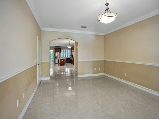 spare room with ornamental molding