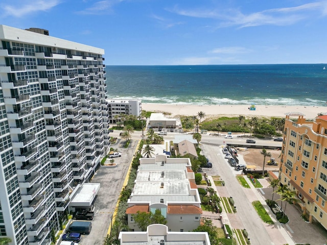 drone / aerial view featuring a view of the beach and a water view