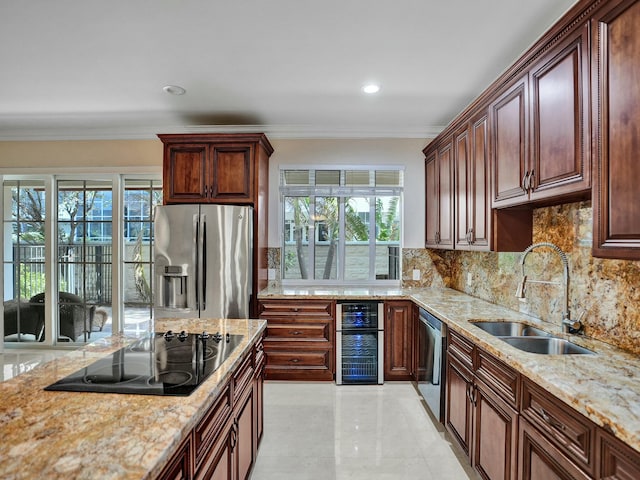 kitchen with a wealth of natural light, tasteful backsplash, sink, ornamental molding, and stainless steel appliances