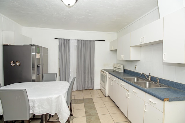 kitchen featuring sink, stainless steel fridge with ice dispenser, light tile patterned floors, electric range, and white cabinets