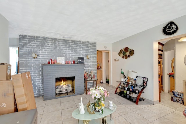 living area featuring a fireplace and tile patterned floors