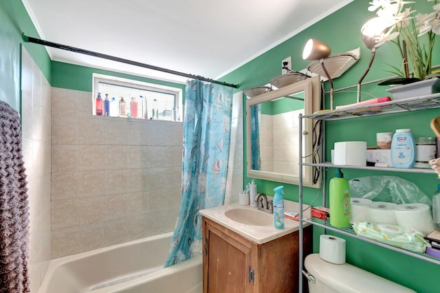 bathroom with toilet, vanity, crown molding, and shower / tub combo