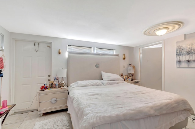 bedroom featuring light tile patterned flooring