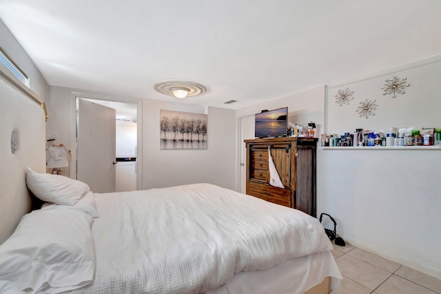 bedroom with light tile patterned floors