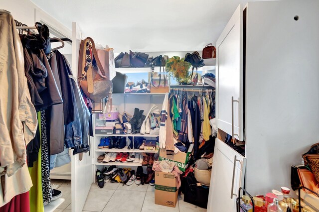 walk in closet featuring tile patterned flooring