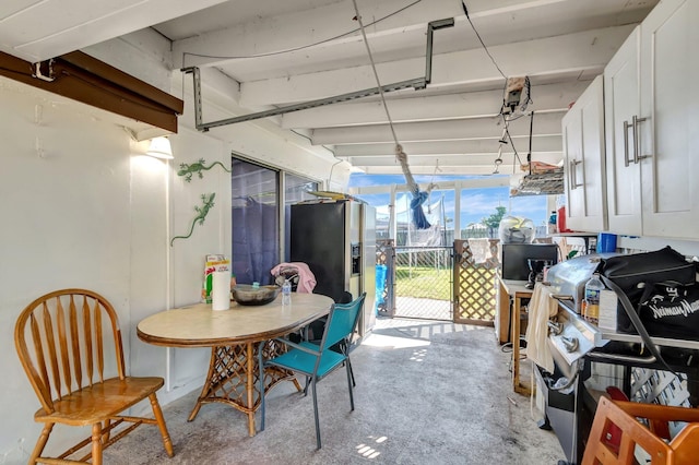 view of patio with a gate and outdoor dining area