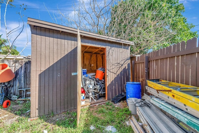 view of shed with a fenced backyard